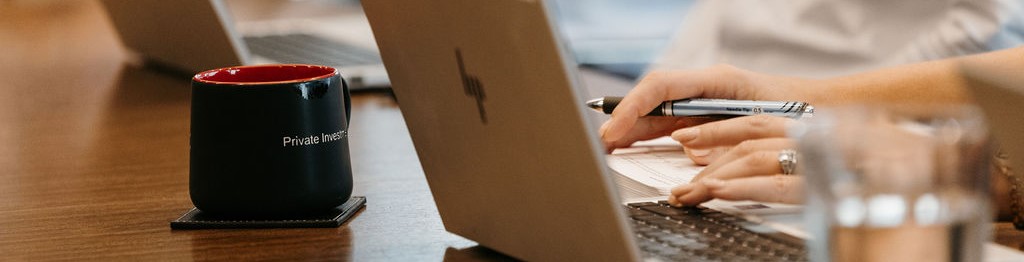 Person writing on paper with pen. Thrivent Private Investment Management